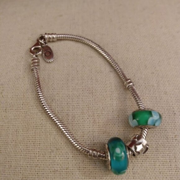 Regal crown: Charm bracelet marked 925 on closure. - Picture 1 of 3